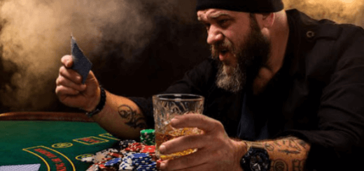 A gambler gambling at a casino in Australia holding a glass of whiskey