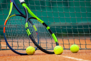 An image of Tennis balls and rackets
